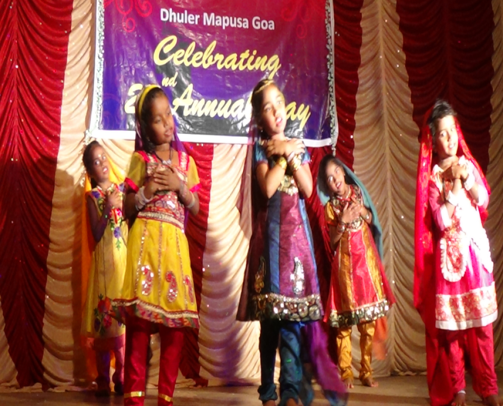 Children performing a dance in front of the audience