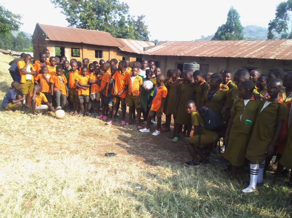 Kihyo Primary School students outside their classrooms_