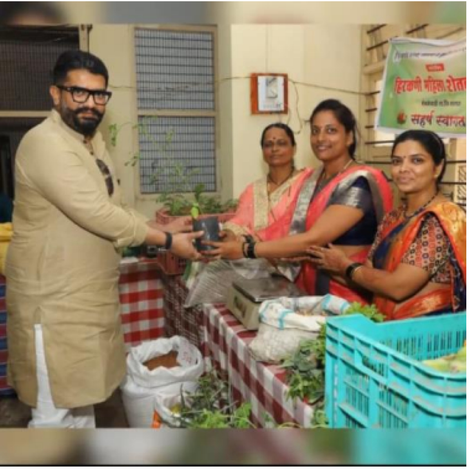 Women's group receiving a sapling from the chief guest