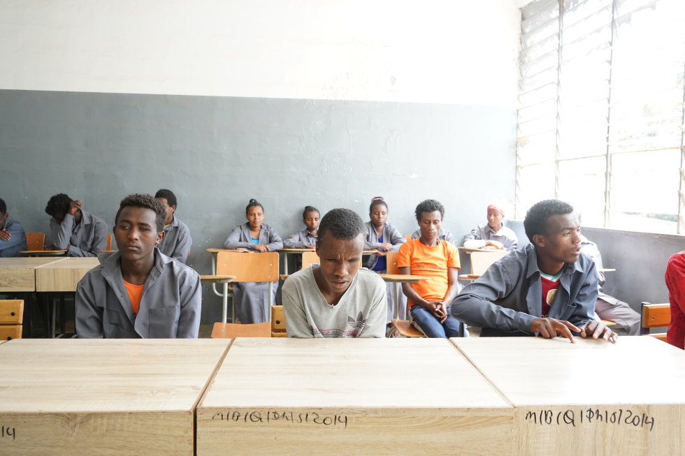 Teenage pupils in classroom