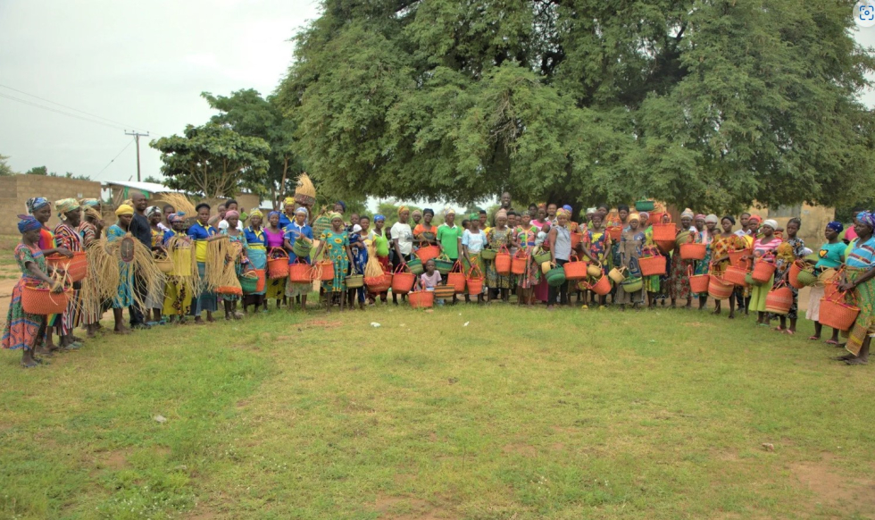 The women of Amanga showing their baskets