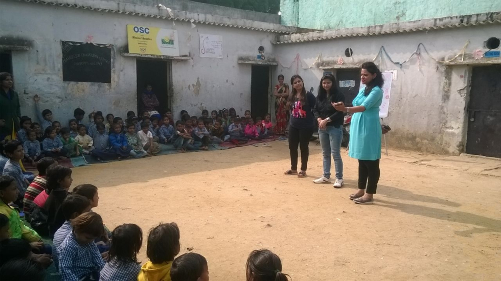 Visitors addressing the children at a Mission Education Centre