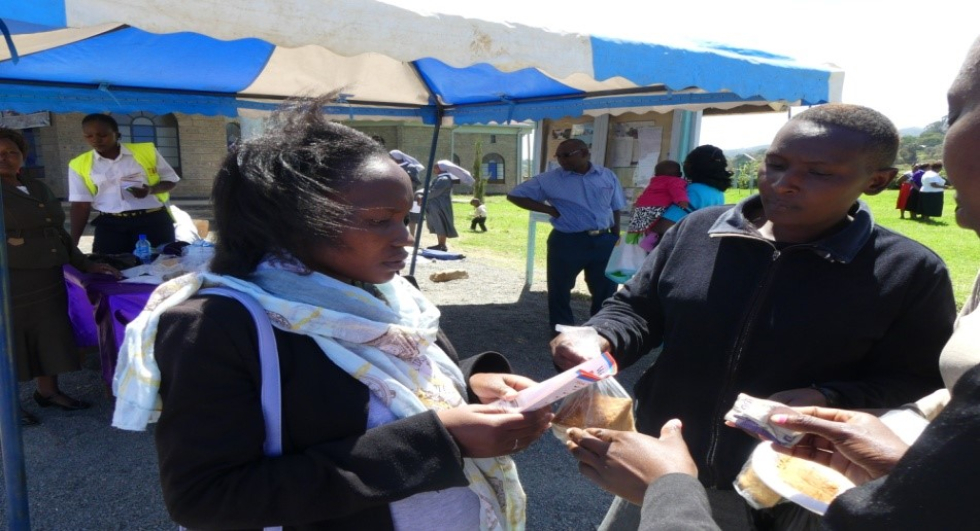 Volunteers selling cakes at a local church