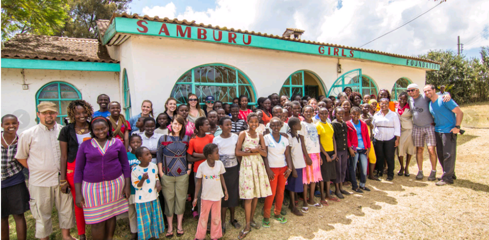 SGF centre with girls and visitors