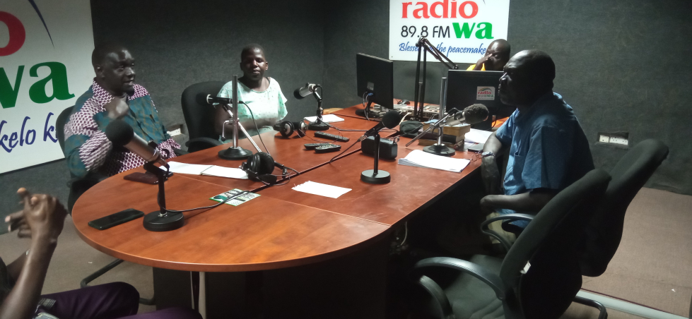 The staff of lango civil society network making an appeal at a radio show