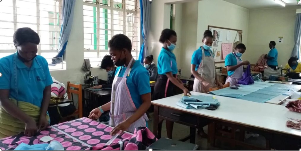 Students learning embroidery at KWPTI
