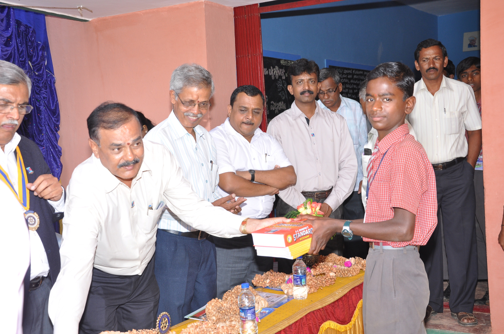 Student receiving the first new books from the library