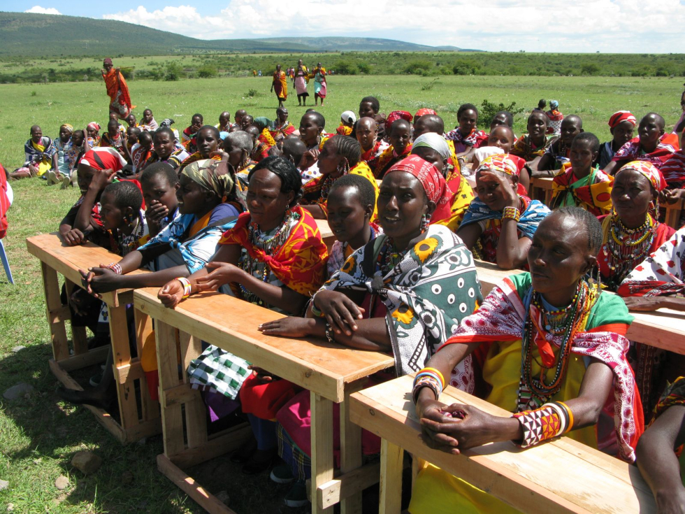 Women taking part in a community meeting