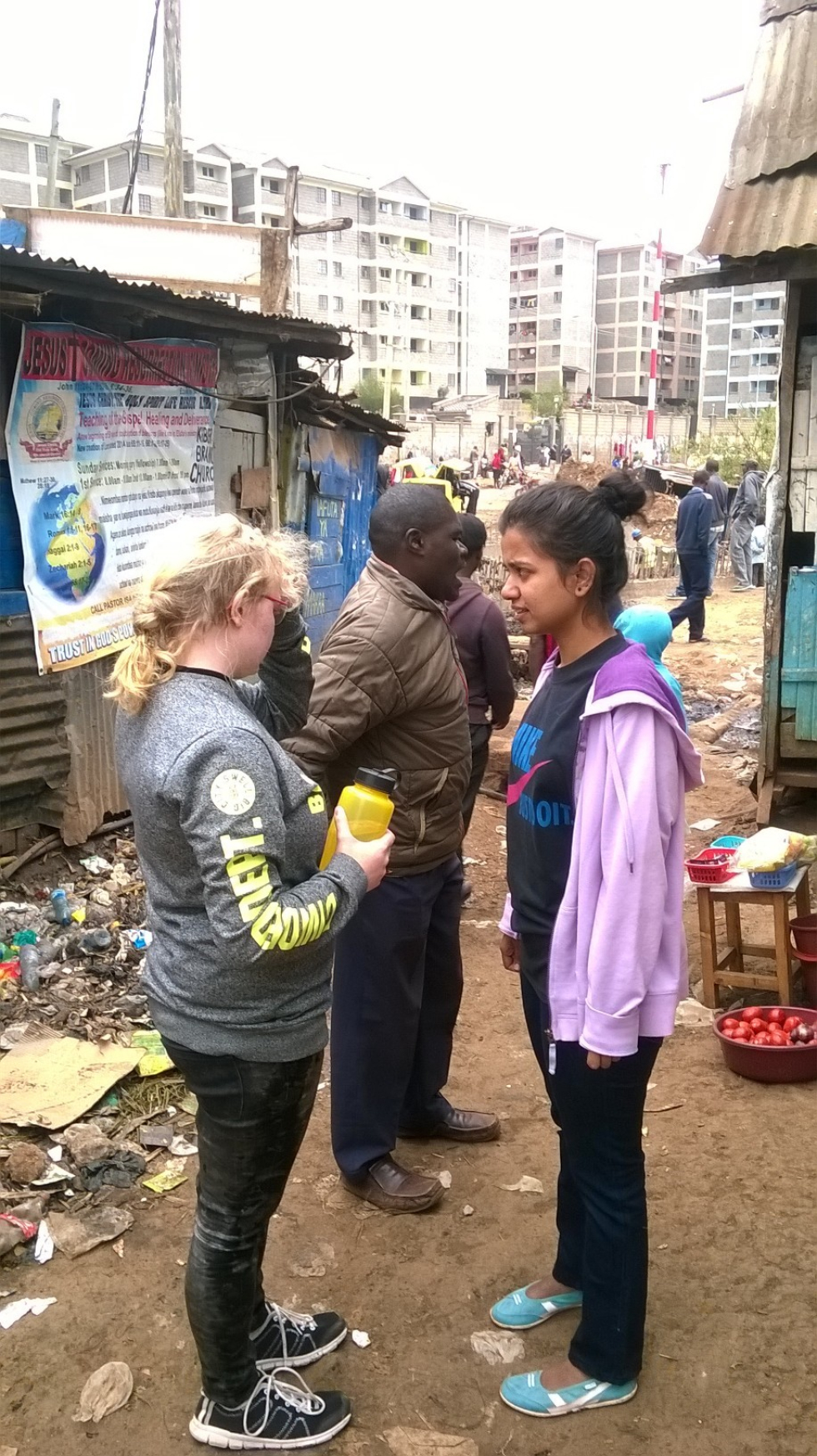 Some of IDEWES international volunteers sensitising the Kibera community on environmental advocacy